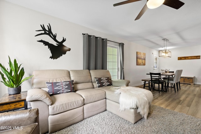 601 Crazy Horse Cir Unit 601, Edwards, CO 81632 - living room featuring ceiling fan and wood finished floors