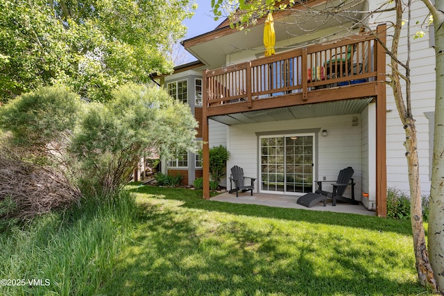 601 Crazy Horse Cir Unit 601, Edwards, CO 81632 - back of house with a patio, a yard, and a deck