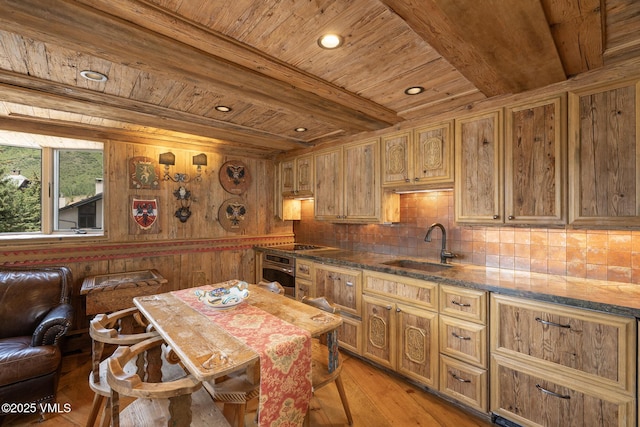 225 Wall St Unit 301, Vail, CO 81657 - kitchen with a wooden ceiling with exposed beams, oven, decorative backsplash, light wood-type flooring, and cooktop