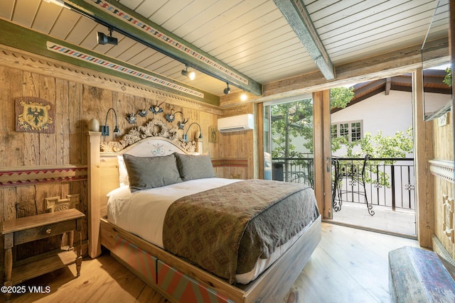 225 Wall St Unit 301, Vail, CO 81657 - bedroom featuring a wall mounted air conditioner, wooden walls, track lighting, access to exterior, and a wooden ceiling with exposed beams