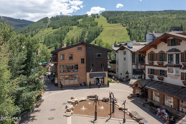225 Wall St Unit 301, Vail, CO 81657 - drone / aerial view of a forest and a mountain backdrop