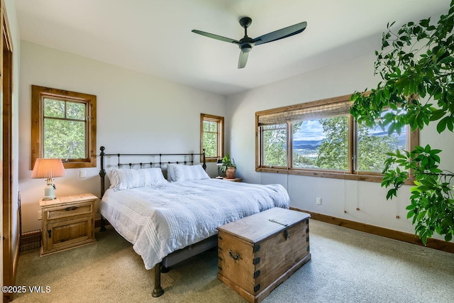 51 Silver Spur, Eagle, CO 81631 - bedroom featuring multiple windows, light colored carpet, and baseboards