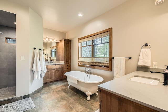51 Silver Spur, Eagle, CO 81631 - full bath with two vanities, tiled shower, a soaking tub, and recessed lighting
