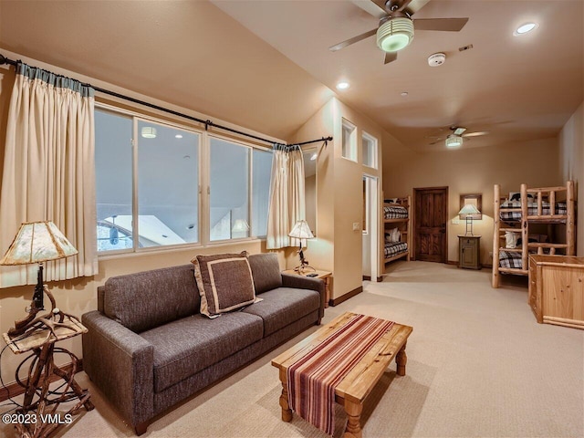 living area featuring light carpet, recessed lighting, baseboards, and ceiling fan