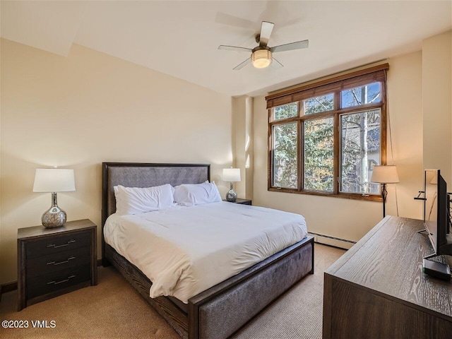 bedroom with light colored carpet, a ceiling fan, and a baseboard radiator