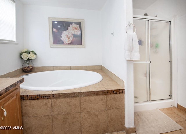 bathroom featuring vanity, tile patterned flooring, and independent shower and bath