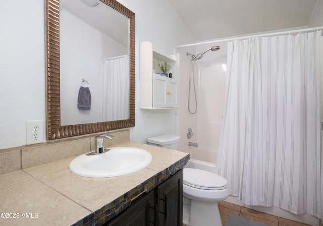 full bathroom featuring vanity, toilet, tile patterned flooring, and shower / tub combo