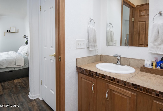 bathroom with vanity and wood-type flooring