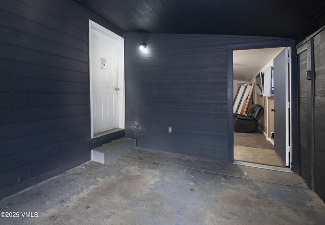 interior space featuring wooden walls