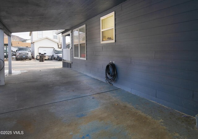 view of patio featuring a garage