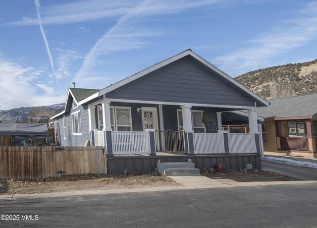 view of front of house featuring a mountain view and covered porch