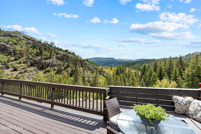 2980 Salt Creek Rd, Eagle, CO 81631 - wooden terrace featuring a view of trees and a mountain view