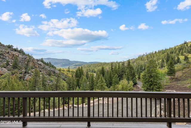 2980 Salt Creek Rd, Eagle, CO 81631 - wooden deck featuring a wooded view and a mountain view