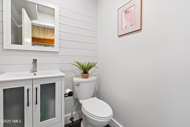2980 Salt Creek Rd, Eagle, CO 81631 - half bathroom featuring vanity and wood walls