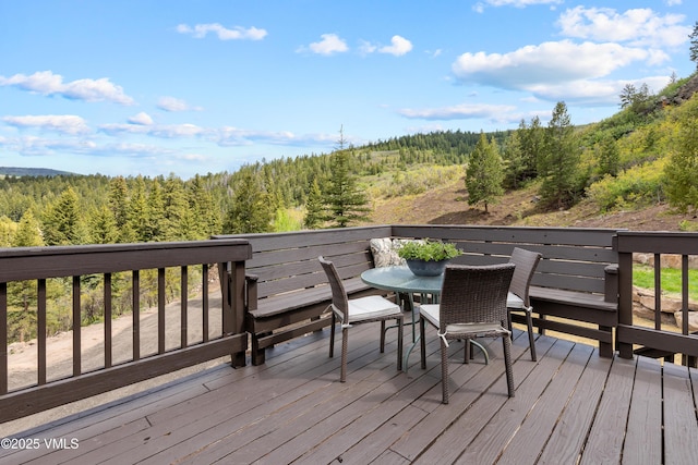 2980 Salt Creek Rd, Eagle, CO 81631 - wooden deck featuring a forest view and outdoor dining space