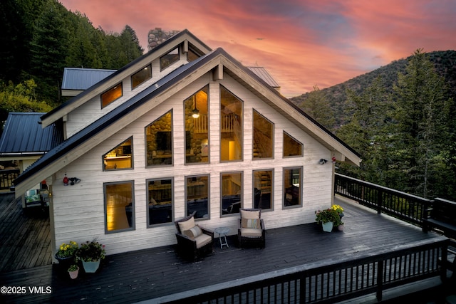 2980 Salt Creek Rd, Eagle, CO 81631 - back of house featuring a deck, a metal roof, and a chimney