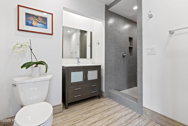 2980 Salt Creek Rd, Eagle, CO 81631 - bathroom featuring vanity, wood finished floors, and a tile shower