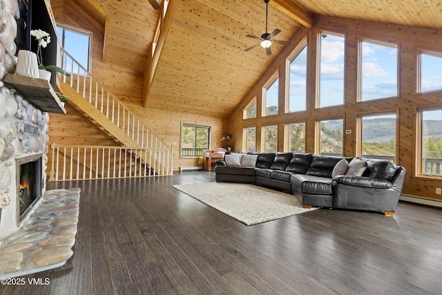 2980 Salt Creek Rd, Eagle, CO 81631 - living room featuring high vaulted ceiling, a wood ceiling with exposed beams, a stone fireplace, a ceiling fan, and stairway