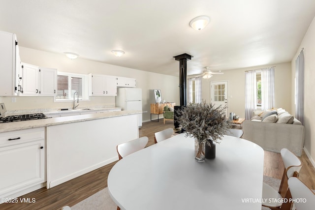 423 Second St, Gypsum, CO 81637 - dining room featuring dark wood-style floors, ceiling fan, and baseboards