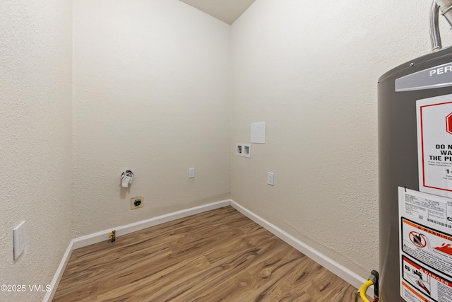 423 Second St, Gypsum, CO 81637 - washroom with wood finished floors, water heater, baseboards, hookup for a washing machine, and electric dryer hookup
