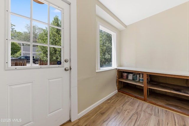 423 Second St, Gypsum, CO 81637 - doorway with baseboards and light wood-style flooring