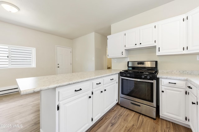 423 Second St, Gypsum, CO 81637 - kitchen with stainless steel range with gas stovetop, a peninsula, light wood-type flooring, white cabinetry, and light stone countertops