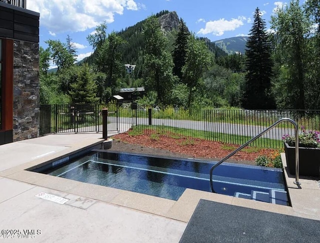 42 Riverfront Ln Unit 205, Avon, CO 81620 - surrounding community featuring uncovered parking and a mountain view