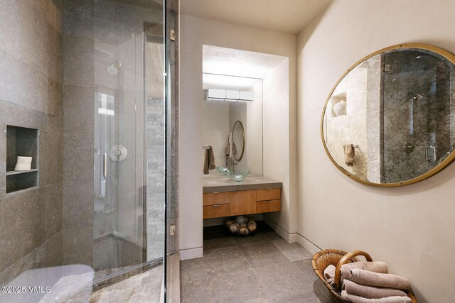 bathroom with vanity and an enclosed shower