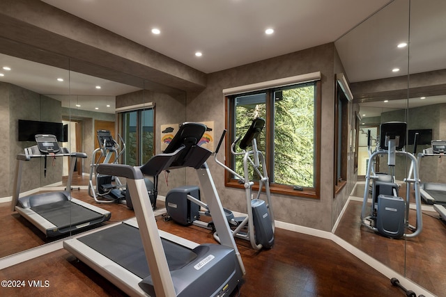 workout room with recessed lighting and baseboards