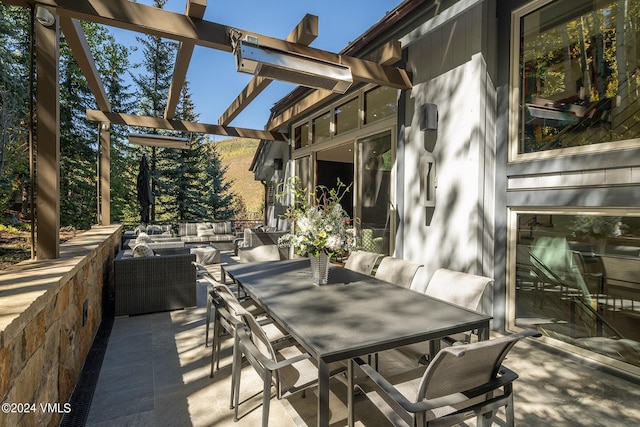 view of patio / terrace with outdoor dining space, outdoor lounge area, and a pergola