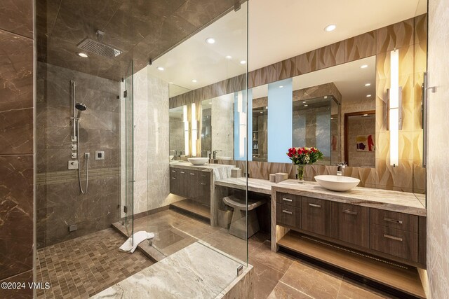 bathroom with a sink, marble finish floor, a shower stall, two vanities, and recessed lighting