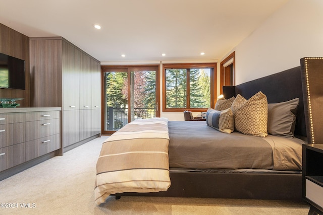 bedroom with light carpet and recessed lighting