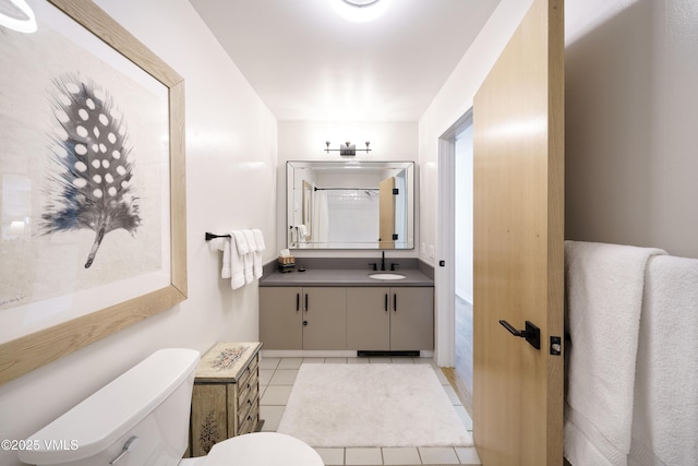 180 Offerson Rd Unit 2, Beaver Creek, CO 81620 - bathroom featuring toilet, vanity, tile patterned floors, and a shower