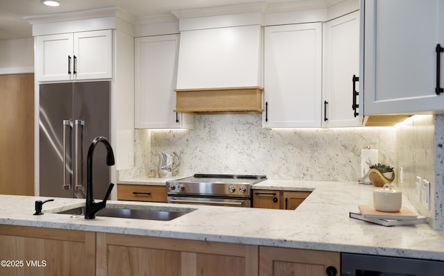 180 Offerson Rd Unit 2, Beaver Creek, CO 81620 - kitchen featuring stainless steel appliances, custom exhaust hood, light stone countertops, backsplash, and recessed lighting