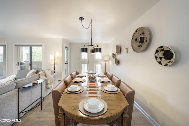 180 Offerson Rd Unit 2, Beaver Creek, CO 81620 - dining space featuring a chandelier and light wood finished floors