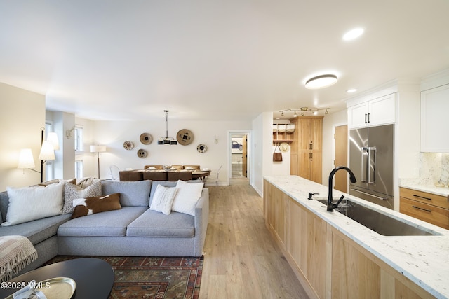 180 Offerson Rd Unit 2, Beaver Creek, CO 81620 - living area featuring light wood finished floors and recessed lighting