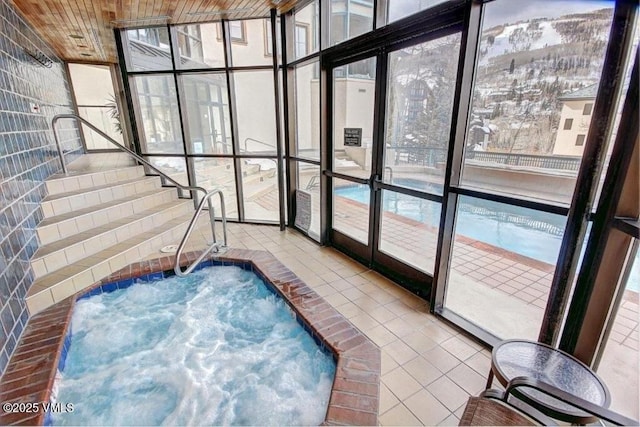 180 Offerson Rd Unit 2, Beaver Creek, CO 81620 - sunroom with a jacuzzi