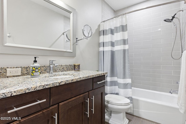 full bathroom featuring shower / tub combo, vanity, and toilet