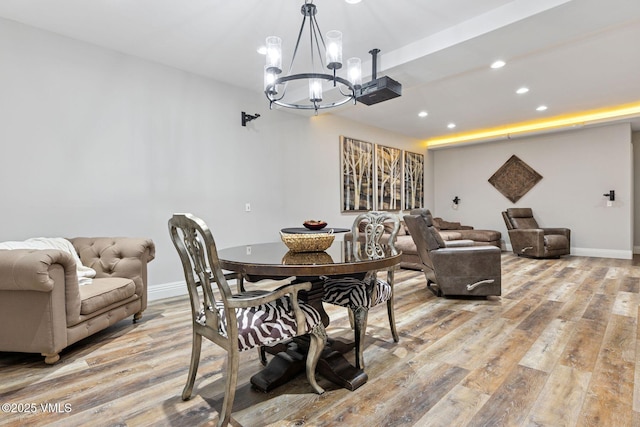 dining space with baseboards, light wood-style flooring, and recessed lighting