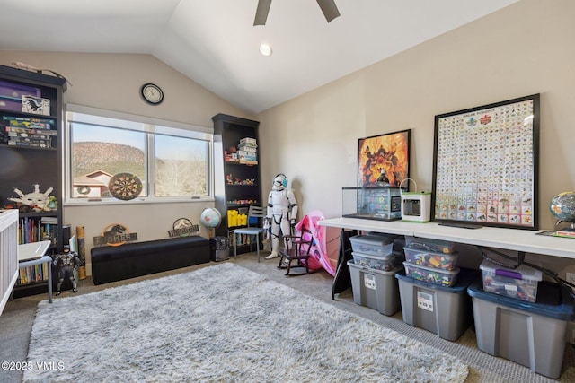 rec room featuring carpet floors, lofted ceiling, and a ceiling fan