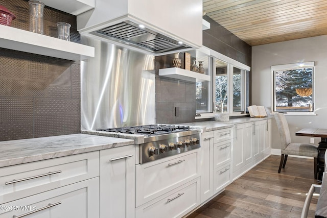 kitchen with wooden ceiling, white cabinets, custom exhaust hood, dark wood finished floors, and stainless steel gas stovetop