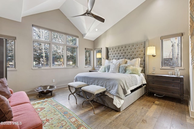 bedroom with wood-type flooring, high vaulted ceiling, ceiling fan, and recessed lighting