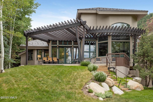 266 Sawatch Dr, Edwards, CO 81632 - back of property featuring a pergola and a lawn