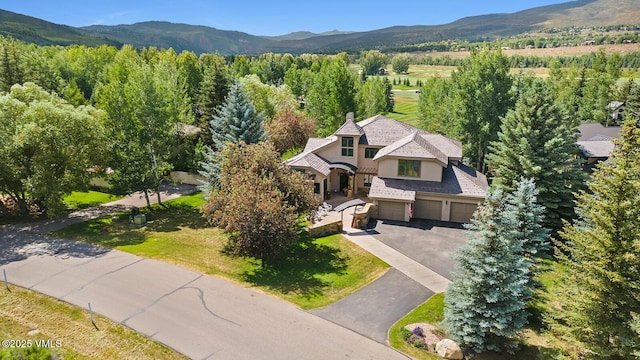 266 Sawatch Dr, Edwards, CO 81632 - aerial view of property and surrounding area with mountains and a forest