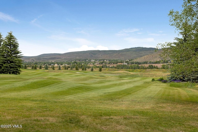 266 Sawatch Dr, Edwards, CO 81632 - view of community featuring a mountain view, golf course view, and a lawn