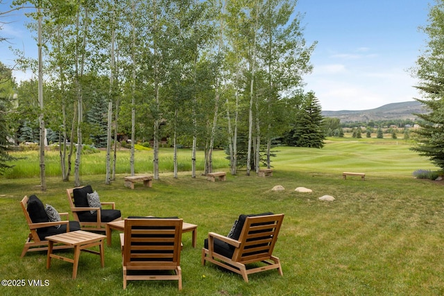 266 Sawatch Dr, Edwards, CO 81632 - view of home's community featuring a yard, a mountain view, golf course view, and view of scattered trees