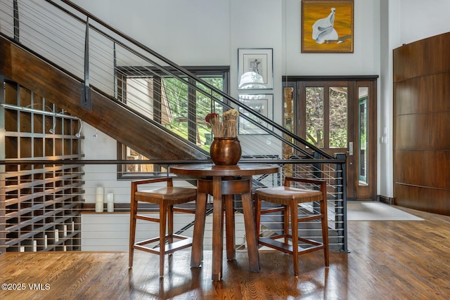 266 Sawatch Dr, Edwards, CO 81632 - unfurnished dining area featuring wood finished floors and stairway