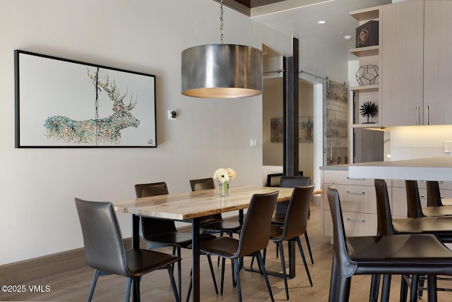 37347 US Highway 6 Unit 101, Avon, CO 81620 - dining room featuring light wood-style floors and baseboards