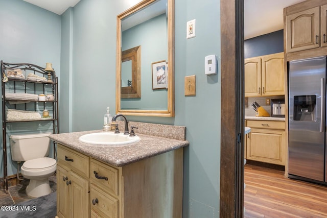 216 Monument St, Red Cliff, CO 81649 - bathroom with vanity, tasteful backsplash, and wood finished floors