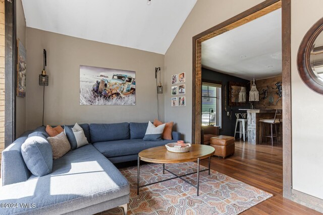 216 Monument St, Red Cliff, CO 81649 - living room featuring wood finished floors and lofted ceiling